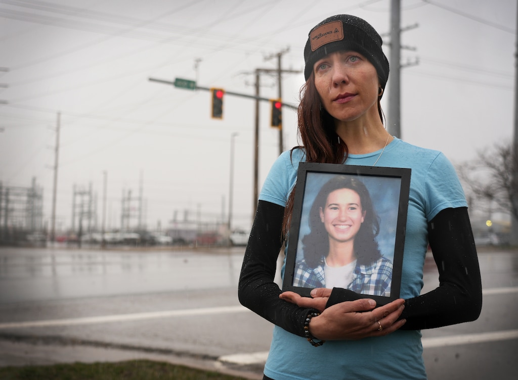 (Bethany Baker | The Salt Lake Tribune) Kseniya Kniazeva, shown here on Wednesday, March 22, 2023, holds a portrait of her friend Megan Mohn at the site where Mohn became unresponsive during her Salt Lake City arrest on Jan. 11, 2022. Mohn died in a hospital 19 days later.