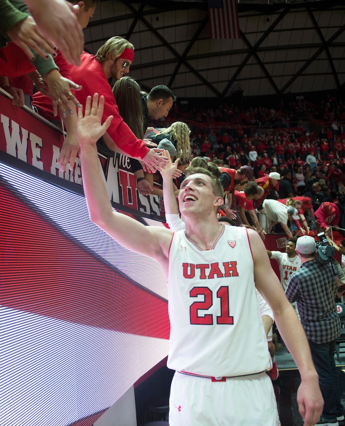 (Rick Egan  |  The Salt Lake Tribune)  Utah Utes forward Tyler Rawson (21) shakes hands with fans as the Utes defeat the Buffaloes 64-54, in PAC-12 basketball action between Utah Utes and Colorado Buffaloes, at the Jon M. Huntsman Center, Saturday, March 3, 2018.