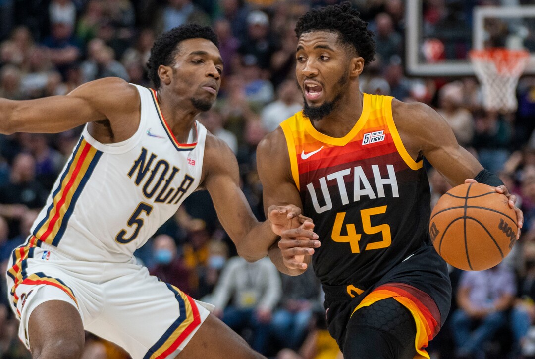 (Rick Egan | The Salt Lake Tribune) Donovan Mitchell (45), takes the ball inside as New Orleans Pelicans forward Herbert Jones (5) defends, in NBA action between the Utah Jazz and the New Orleans Pelicans, at Vivint Arena, in Salt Lake City, on Friday, Nov. 26, 2021.