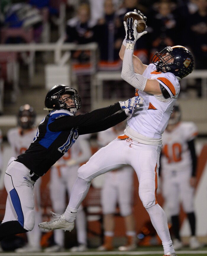 (Francisco Kjolseth  |  The Salt Lake Tribune)  Cooper Roudy of Stansbury puts pressure on Nicholas Nerhercott of Mountain Crest in their class 4A semifinal game at Rice-Eccles Stadium, Thursday, Nov. 9, 2017.