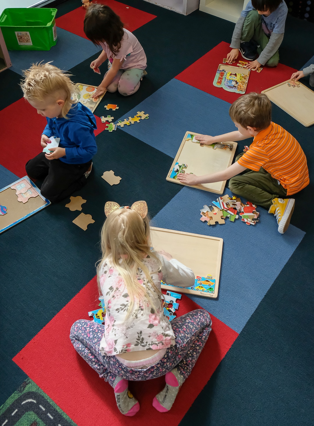 (Francisco Kjolseth  |  The Salt Lake Tribune) Children, many of them with parents who are first responders, play with puzzles at The Buddy Bin child care business in North Salt Lake on Thursday. Though they have seen a dramatic drop in the number of kids coming, the staff at The Buddy Bin are also trying to help families who are first responders and essential workers as they take many precautions to stay open on Thursday, March 26, 2020.