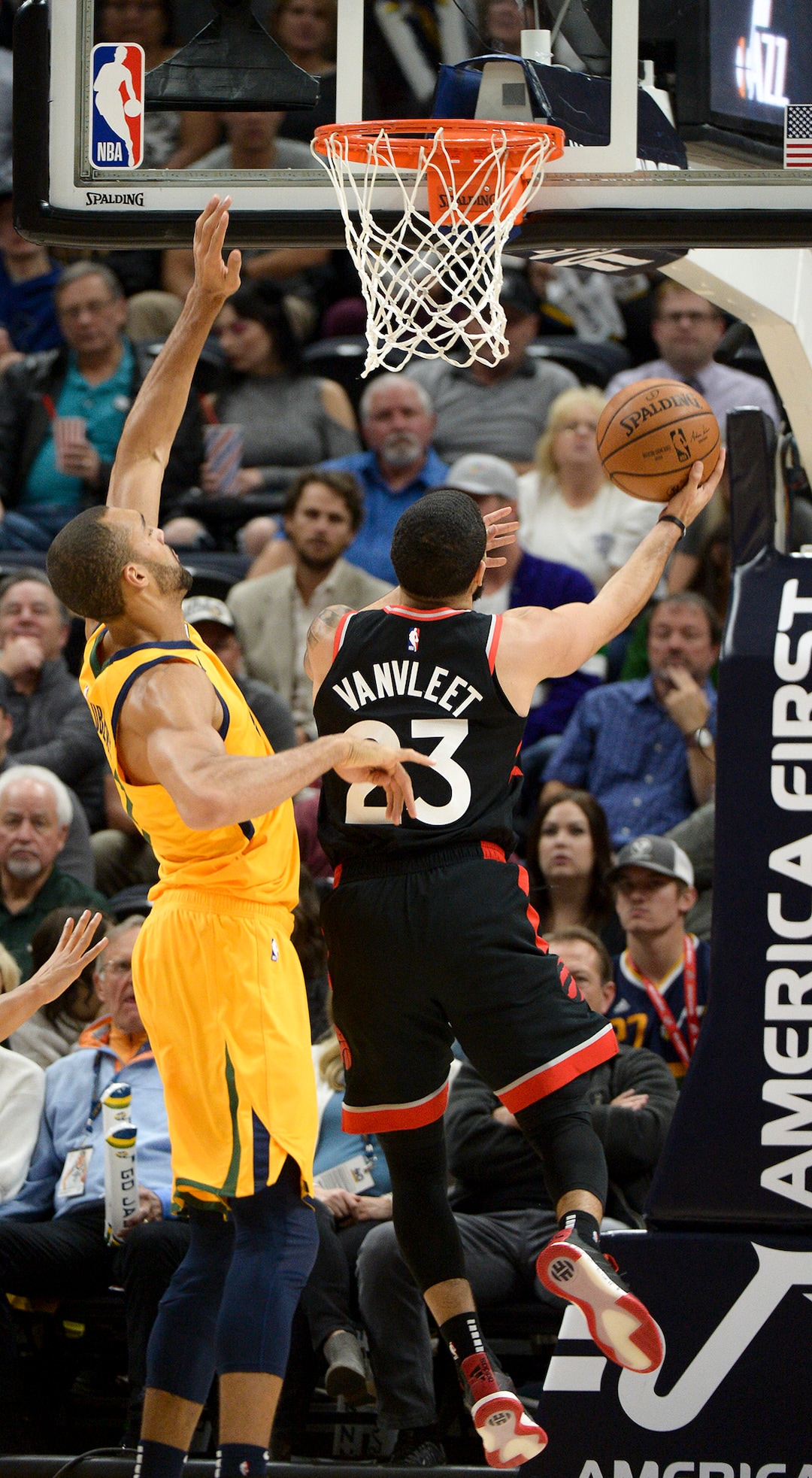 Leah Hogsten  |  The Salt Lake Tribune Toronto Raptors guard Fred VanVleet (23) shoots around Utah Jazz center Rudy Gobert (27) as the Utah Jazz host the Toronto Raptors, Monday, Nov. 5, 2018 at  Vivint Smart Home Arena.