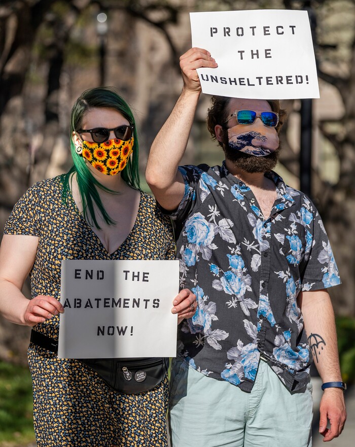 (Rick Egan | The Salt Lake Tribune) Ashley and Duran Adams join in a chant during a rally demanding an end to the policy of violence and terror inflicted on our unsheltered community at the hands of the Salt Lake County Health Department, Salt Lake City, and Salt Lake City Police Department, at Washington Square, on Friday, April 2, 2021.