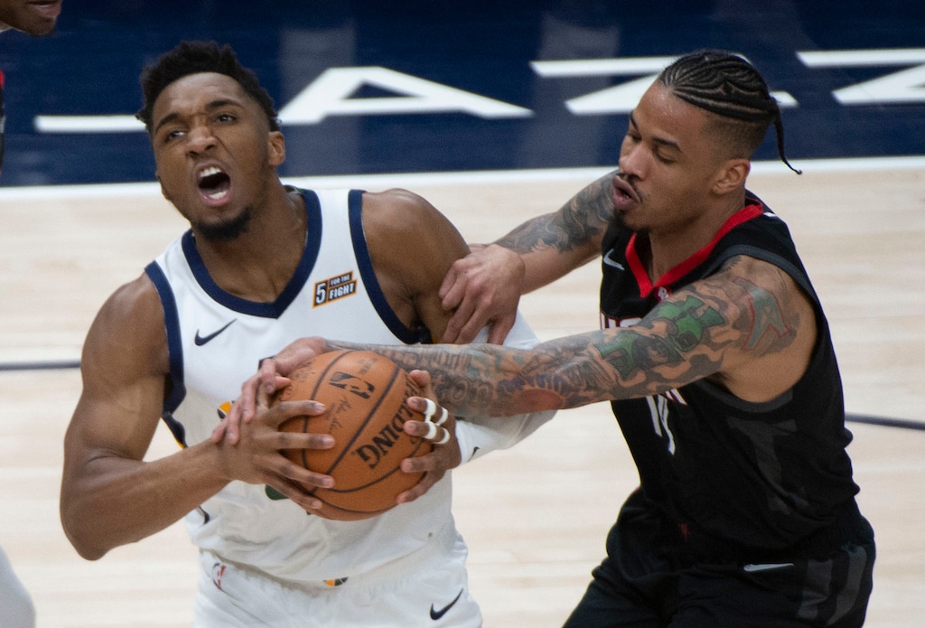 (Rick Egan  |  The Salt Lake Tribune)  Utah Jazz guard Donovan Mitchell (45) is fouled by Houston Rockets guard Gerald Green (14), in NBA playoffs between the Utah Jazz and the Houston Rockets in Salt Lake City, Monday, April 22, 2019. Sinclair Broadcast Group may soon acquire the Utah Jazz's local television rights.