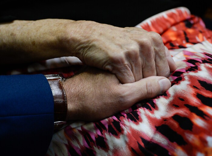 (Francisco Kjolseth  |  The Salt Lake Tribune)  Grant Stanfield embraces the hand of his mother Connie Elison, as they speak about their brother and son, Thomas Stanfield, who was shot and killed by a Citadel security guard last week. The two spoke with the press at the offices of their attorney, Robert Sykes, in Salt Lake City on Tuesday, June 26, 2018, after filing a civil rights and wrongful death law suit.