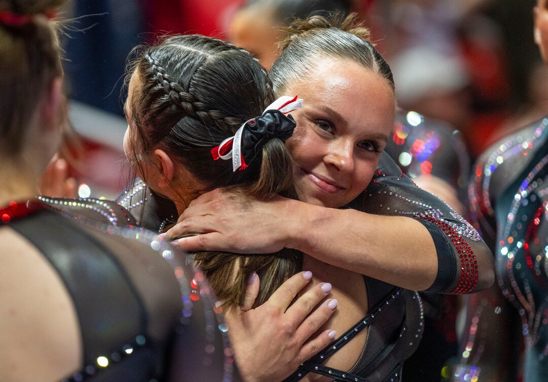 (Rick Egan | The Salt Lake Tribune)  Maile O'Keefe gets hug form a team mate after scoring a 10 on the beam, in gymnastics action between Utah  Red Rocks and Oregon State, at the Jon M. Huntsman Center, on Friday, Feb. 2, 2024.