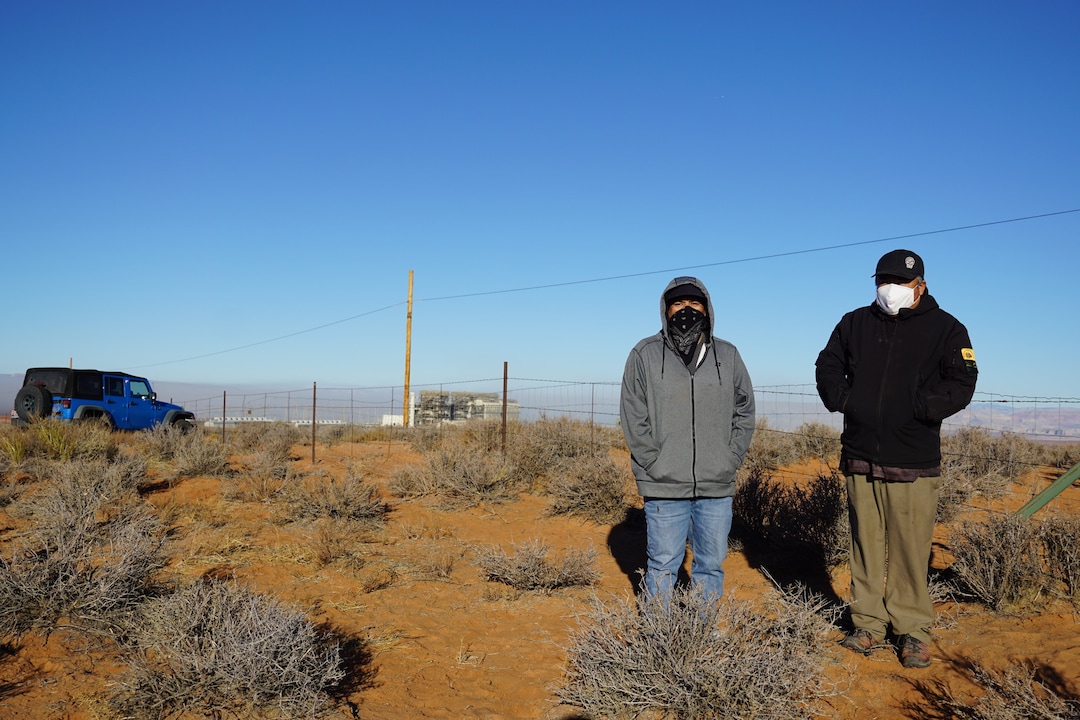 (Zak Podmore | The Salt Lake Tribune) Jerrick Holiday (left) and Dustin Attakai came out to watch the demolition of Navajo Generating Station on December 18, 2020.