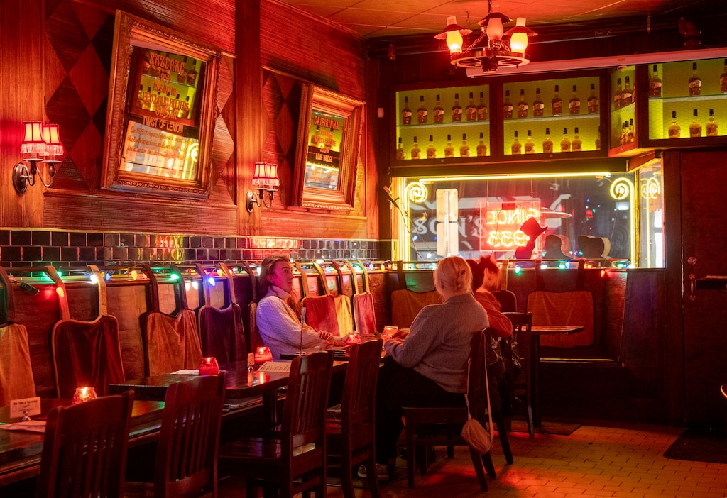 (Rick Egan | The Salt Lake Tribune)  Amanda Wight, Jess Tocheri and Chris Pynes enjoy a visit to Bar X, in Salt Lake City, on Thursday, Dec. 26, 2024.