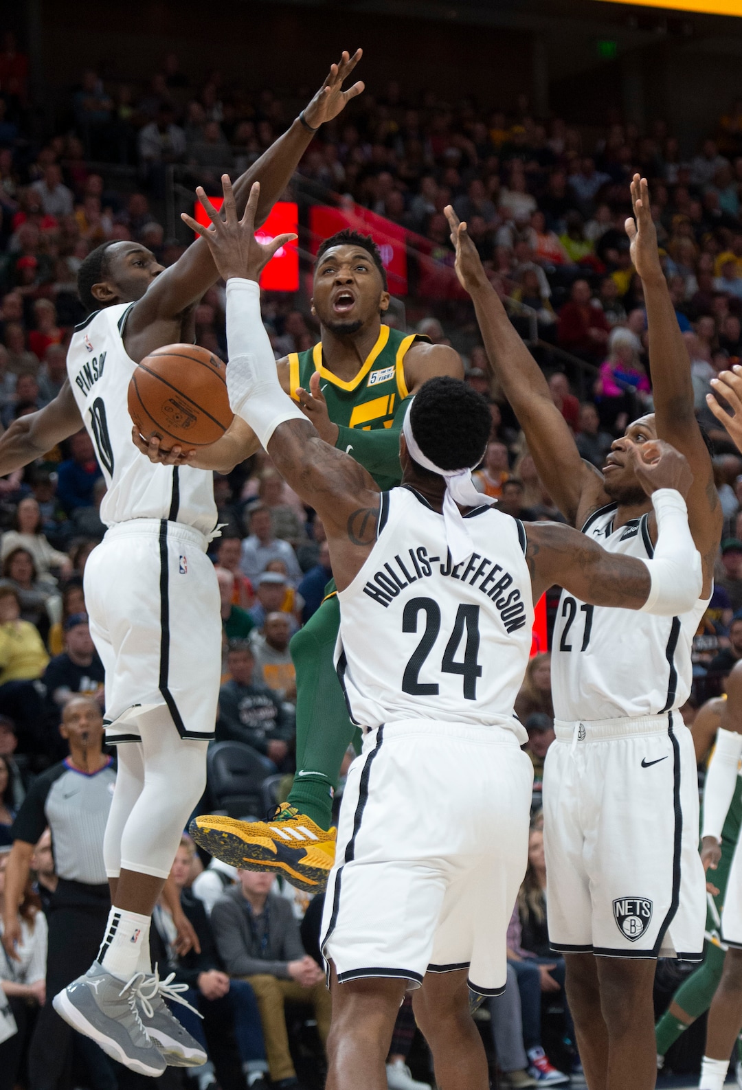 (Rick Egan  |  The Salt Lake Tribune)  Utah Jazz guard Donovan Mitchell (45) dribbles into a triple-team Nets defense, in NBA action between Utah Jazz and Brooklyn Nets, at  Vivint Smart Home Arena, Saturday, March 17, 2019.