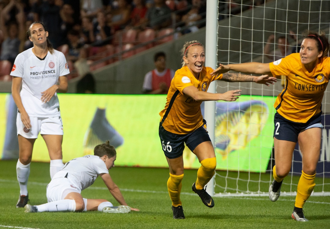 (Rick Egan  |  The Salt Lake Tribune)    Utah Royals FC midfielder Gunnhildur Jónsdóttir (66) celebrates after Utah Royals FC defender Rachel Corsie (2) scored the game tying goal, in Soccer action between Utah Royals FC and Portland Thorns FC, in Sandy, Friday, July 19, 2019.