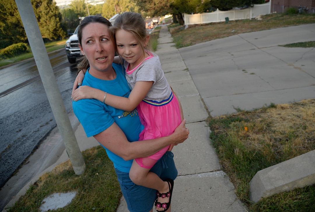 (Francisco Kjolseth  |  The Salt Lake Tribune)  Alysa Albertine is joined by her daughter Emery, 6, as she recalls the harrowing experience of having to flee her home in East Bountiful when a wildfire ignited in the early hours on Friday morning, Aug. 30, 2019. The fire was so close her shed was destroyed and three of her neighbors experienced a total loss of their homes. On Sept. 2, officials said the fire was 100% contained.