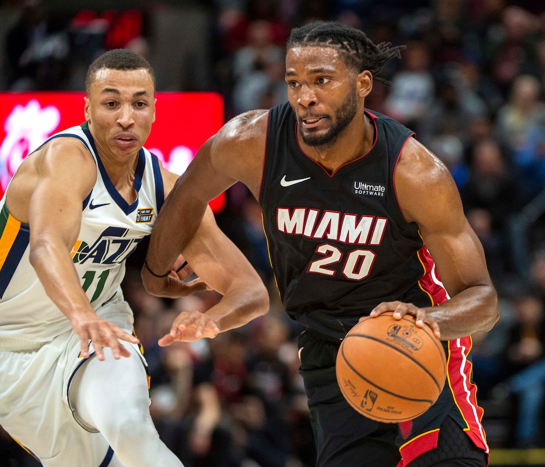 (Rick Egan  |  The Salt Lake Tribune)     Utah Jazz guard Dante Exum (11) defends as Miami Heat forward Justise Winslow (20) takes the ball down the middle, in NBA action between Utah Jazz and Miami Heat, at Viint Smart Home Arena Wednesday, Dec. 12, 2018.