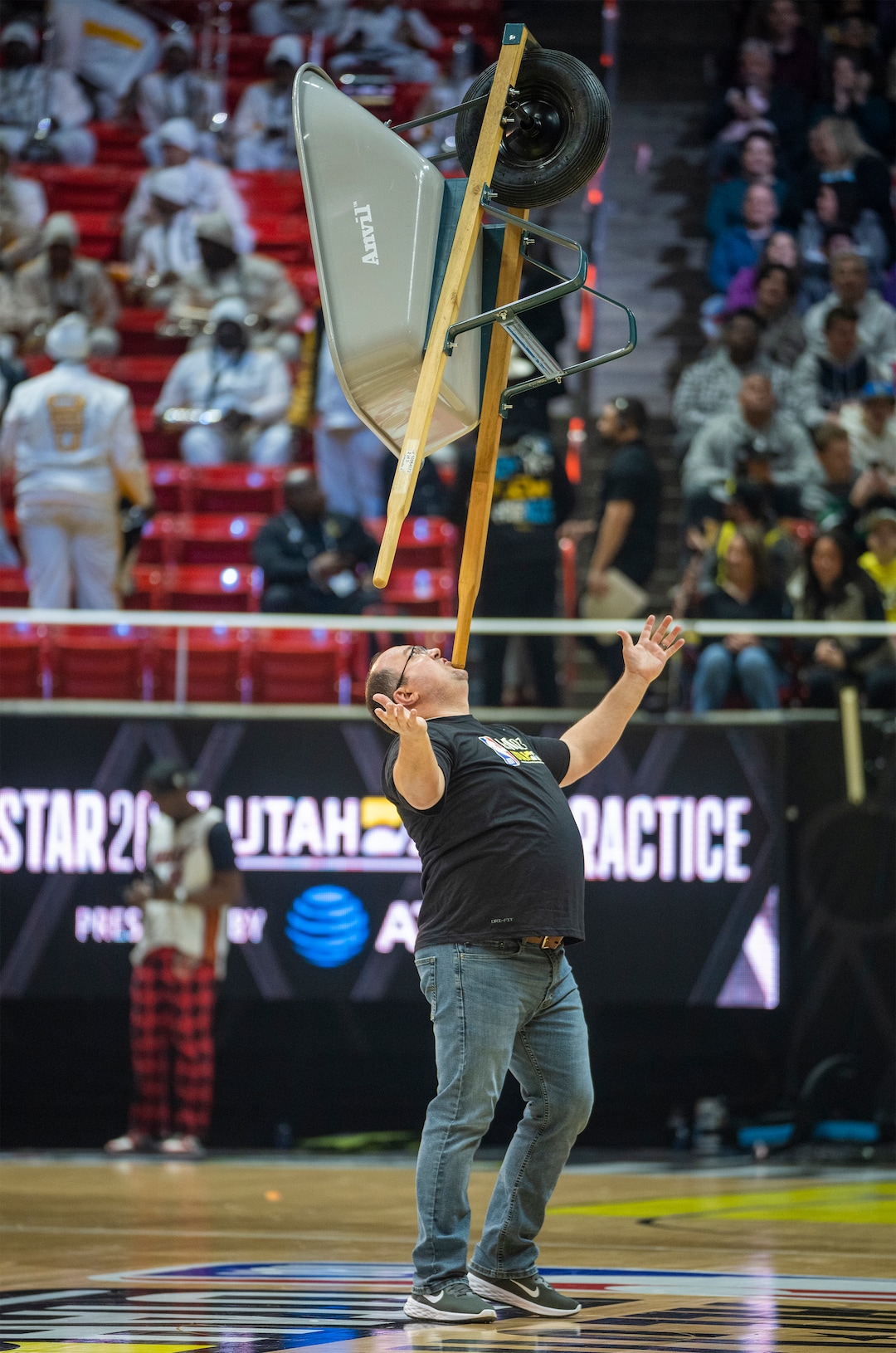 (Rick Egan | The Salt Lake Tribune) A man balances a wheelbarrow on his chin, during the All-Star Practice at the Jon M. Huntsman Center, on Saturday, Feb. 18, 2023.