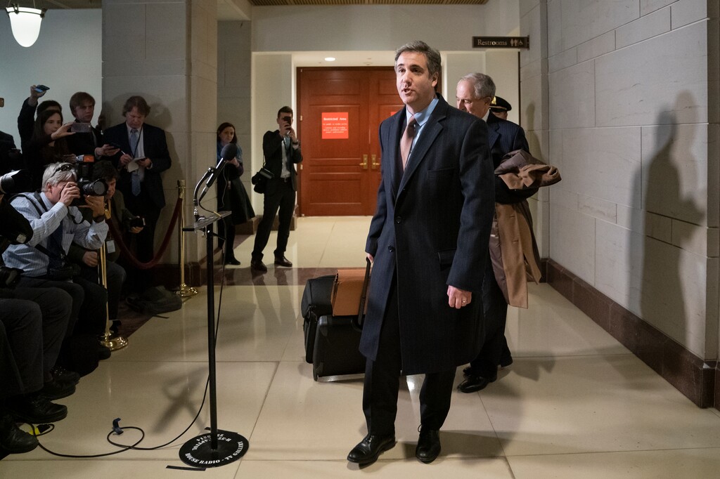 Michael Cohen, President Donald Trump's former lawyer, tells reporters he will "continue to cooperate" with investigators following a full day of testimony with the House Intelligence Committee as he prepares for a three-year prison sentence for lying to Congress and other charges, at the Capitol in Washington, Wednesday, March 6, 2019. (AP Photo/J. Scott Applewhite)