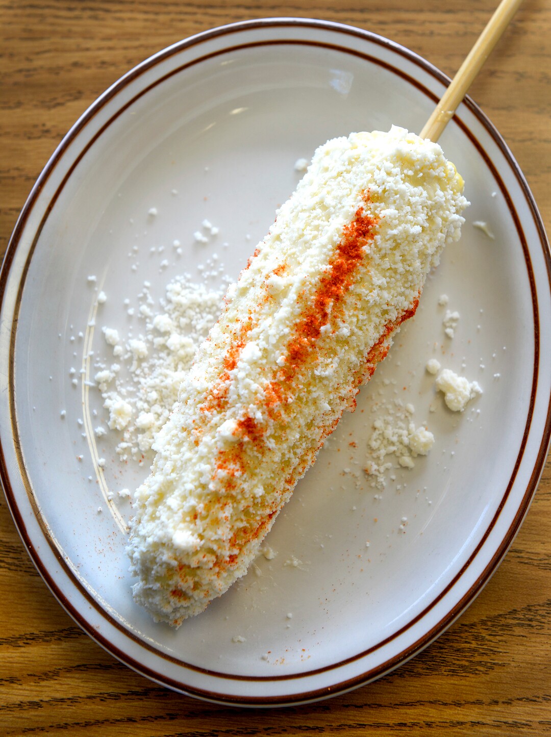 Leah Hogsten  |  The Salt Lake Tribune  The elote or corn on the cob at Taqueria Los Lee' is roasted over an open grill, coated with salt, chile powder, butter, cotija cheese, lime juice, and crema fresca.