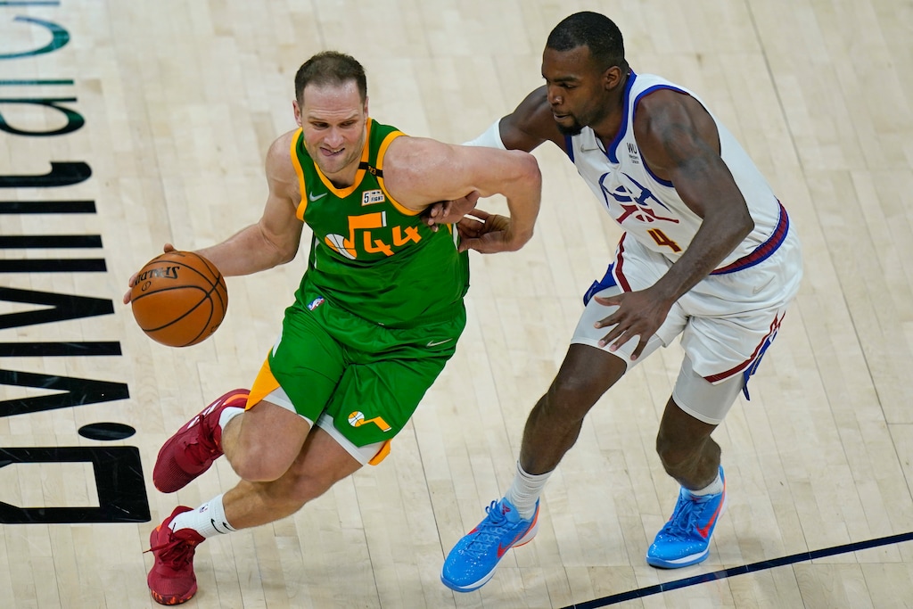 Denver Nuggets forward Paul Millsap (4) guards Utah Jazz forward Bojan Bogdanovic (44) during the first half of an NBA basketball game Friday, May 7, 2021, in Salt Lake City. (AP Photo/Rick Bowmer)