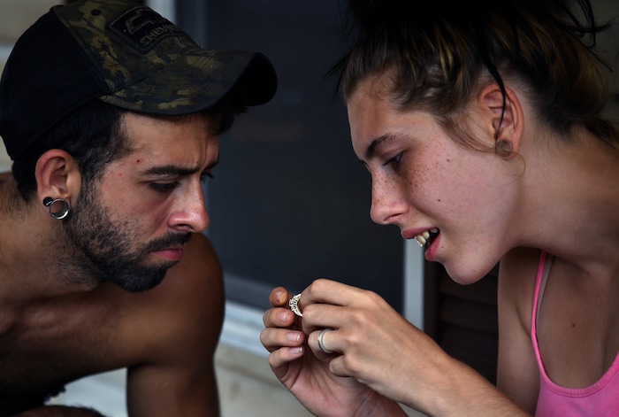 (Washington Post photo by Michael S. Williamson) Maria, worried that her engagement ring was getting dirty, inspects it with her husband, Phil.