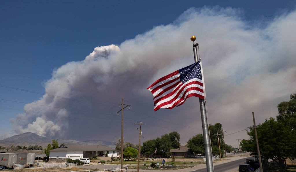 (Francisco Kjolseth | The Salt Lake Tribune) The Iron Fire burns west of Elberta in Juab County on Monday, June 22, 2026. Winds out of the south are bringing smoke from that fire toward Salt Lake City.