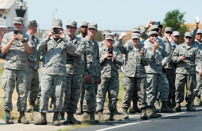 (Rick Egan  |  The Salt Lake Tribune)  Airmen cheer on the racers as they ride through Hill Air Force Base in stage 5, of the Tour of Utah, Friday, August 4, 2017.


