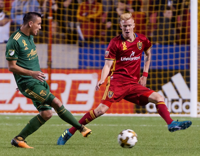 Michael Mangum  |  Special to the Tribune

Real Salt Lake defender Justen Glad (15) applies pressure to Portland Timbers midfielder David Guzman (20) during their MLS match at Rio Tinto Stadium in Sandy, UT on Saturday, September 16, 2017.