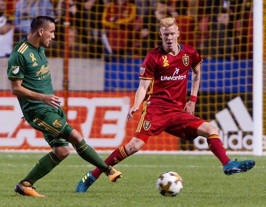 Michael Mangum  |  Special to the TribuneReal Salt Lake defender Justen Glad (15) applies pressure to Portland Timbers midfielder David Guzman (20) during their MLS match at Rio Tinto Stadium in Sandy, UT on Saturday, September 16, 2017.