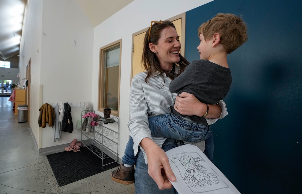 (Francisco Kjolseth | The Salt Lake Tribune) Kathryn Macdonald-Poelman, a mother of three, picks up her youngest son Ezra, 3, at the Dancing Moose Montessori School, a private child care center and preschool in West Valley City on Tuesday, May 19, 2026.