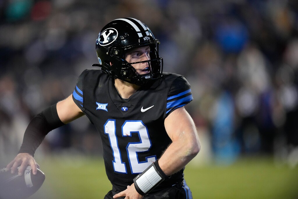 (Francisco Kjolseth  |  The Salt Lake Tribune) Brigham Young Cougars quarterback Jake Retzlaff (12) runs the ball as he looks for an opening during their NCAA college football loss to Iowa State 45-13 on Saturday, Nov. 11, 2023, in Provo, Utah. 