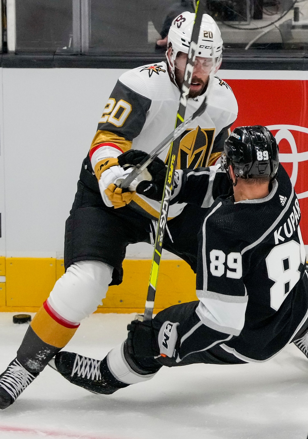 (Leah Hogsten | The Salt Lake Tribune) Los Angeles Kings center Rasmus Kupari (89) hits the ice battling Vegas Golden Knights center Chandler Stephenson (20) for possession as the Los Angeles Kings and Vegas Knights meet in a preseason game at Vivint Arena on Sept. 30, 2021.