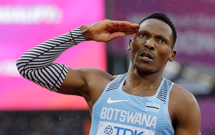 Botswana's Isaac Makwala salutes the crowd after finishing a Men's 200m individual time trial during the World Athletics Championships in London Wednesday, Aug. 9, 2017. Makwala ran an individual time trial to qualify for the 200m semi-finals after he missed the 200m heats and the 400m final as he was barred from competing for 48 hours while organisers tried to halt a norovirus outbreak. (AP Photo/David J. Phillip)