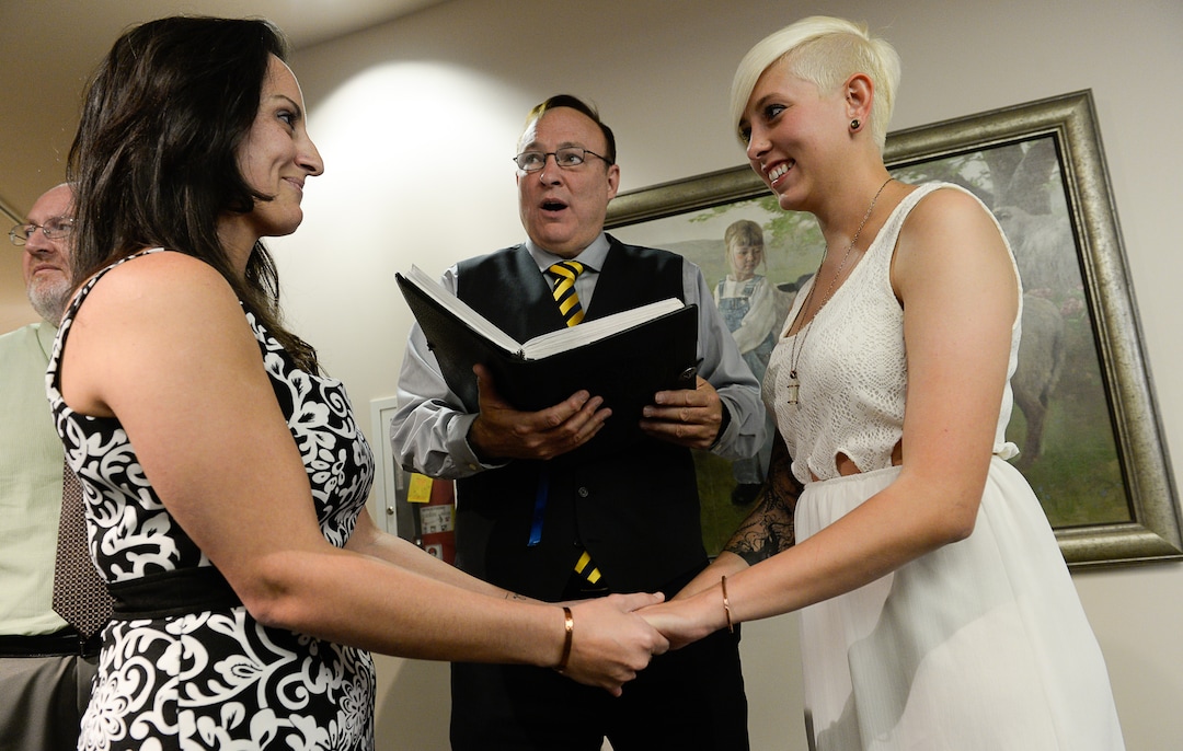 Francisco Kjolseth  |  The Salt Lake TribuneSenator Jim Dabakis marries Yolanda Pascua, left, and Laekin Rogers on Monday at the Salt Lake County Complex. The U.S. Supreme Court declined to review all five pending same-sex marriage cases on Monday, Oct. 6, 2014 effectively legalizing gay and lesbian unions, clearing the way for such marriages to proceed in eleven new states - including Utah.