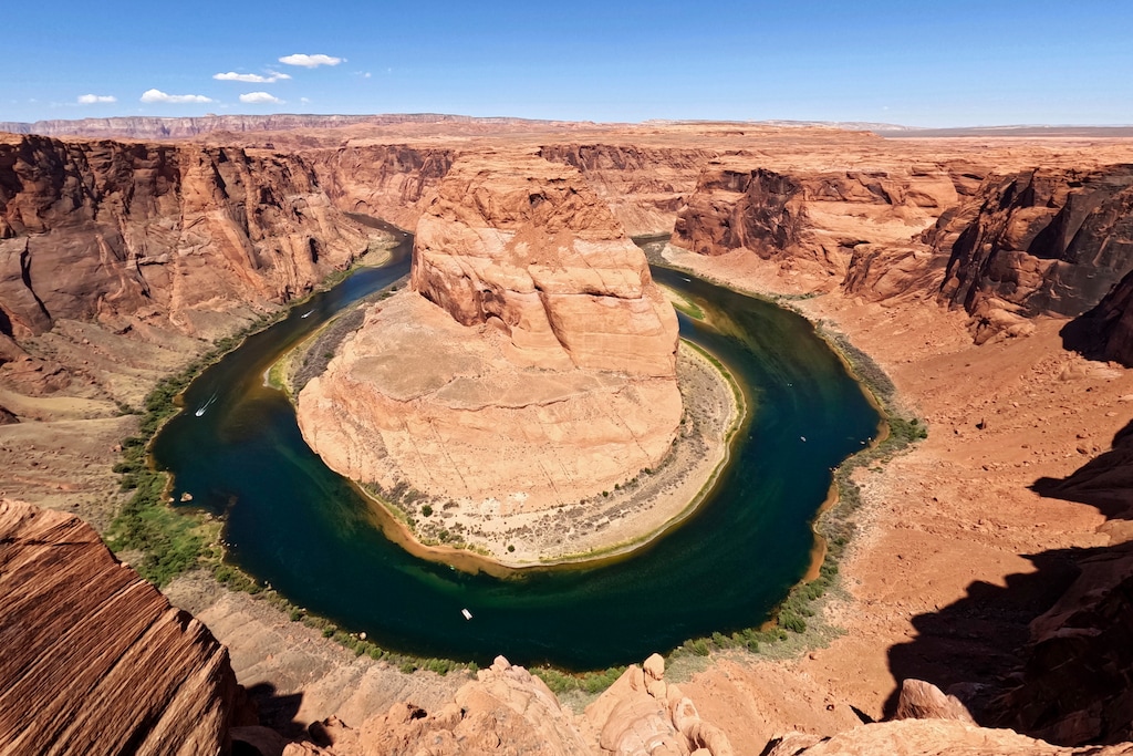 (Brittany Peterson | AP) The Colorado River flows at Horseshoe Bend in Glen Canyon National Recreation Area in 2022. Water negotiators across the American West are negotiating how to manage the river and its reservoirs, and they might not make a looming deadline.