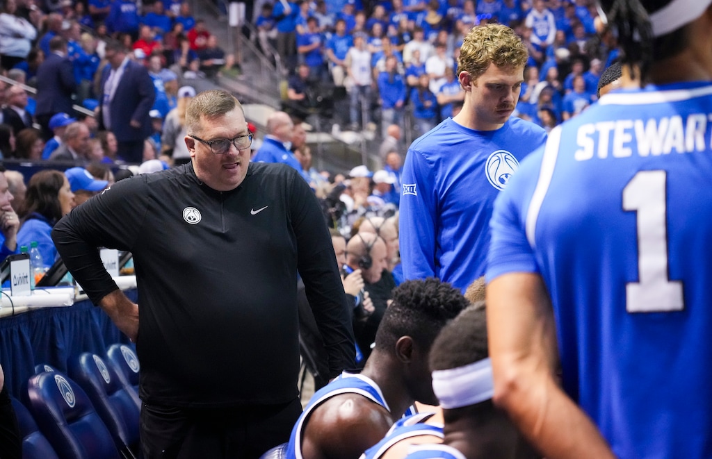 (Bethany Baker  |  The Salt Lake Tribune) Brigham Young Cougars Director of Recruiting Justin Young watches during a time out during the game between the Brigham Young Cougars and the Utah Utes in Provo on Saturday, March 8, 2025.