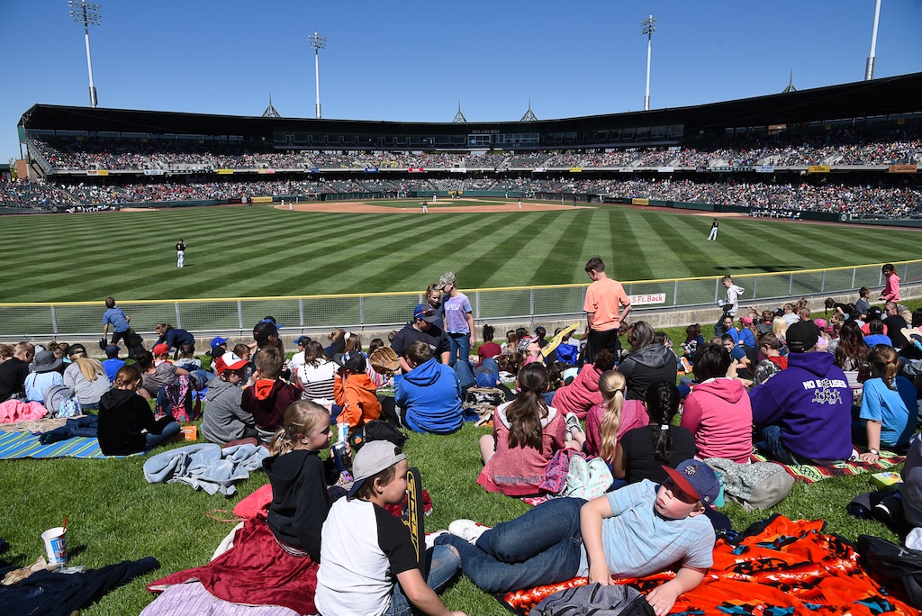 (Francisco Kjolseth  |  The Salt Lake Tribune)  Kids lounge in the outfield as part of the annual Bees kids day game at Smith's Ballpark on Thursday, May 2, 2019.