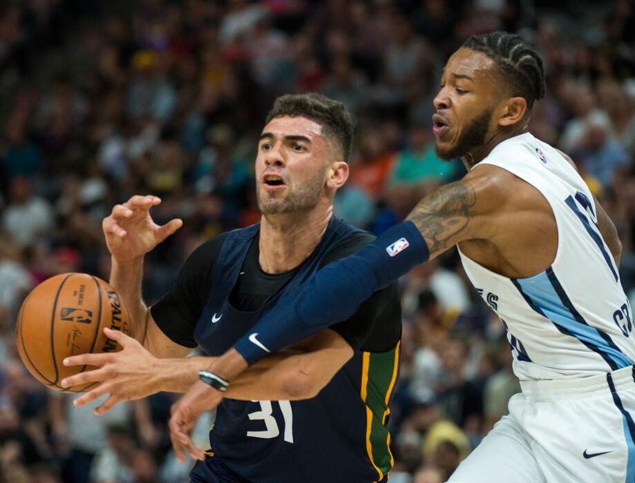 (Rick Egan  |  The Salt Lake Tribune)      Memphis Grizzlies Markel Crawford. knocks the ball out of the hands of Utah Jazz forward Georges Niang (31), in Utah Jazz summer league action between Utah Jazz and Memphis Grizzlies in Salt Lake City, Tuesday, July 3, 2018.