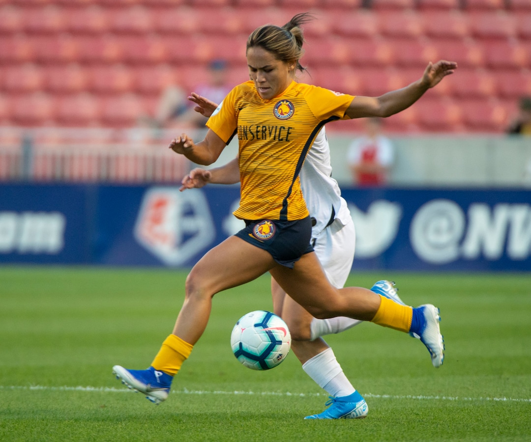 (Rick Egan  |  The Salt Lake Tribune)    Utah Royals FC midfielder Lo'eau LaBonta (9) goes for the ball along with Portland Thorns FC defender Elizabeth Ball (27), in Soccer action between Utah Royals FC and Portland Thorns FC, in Sandy, Friday, July 19, 2019.