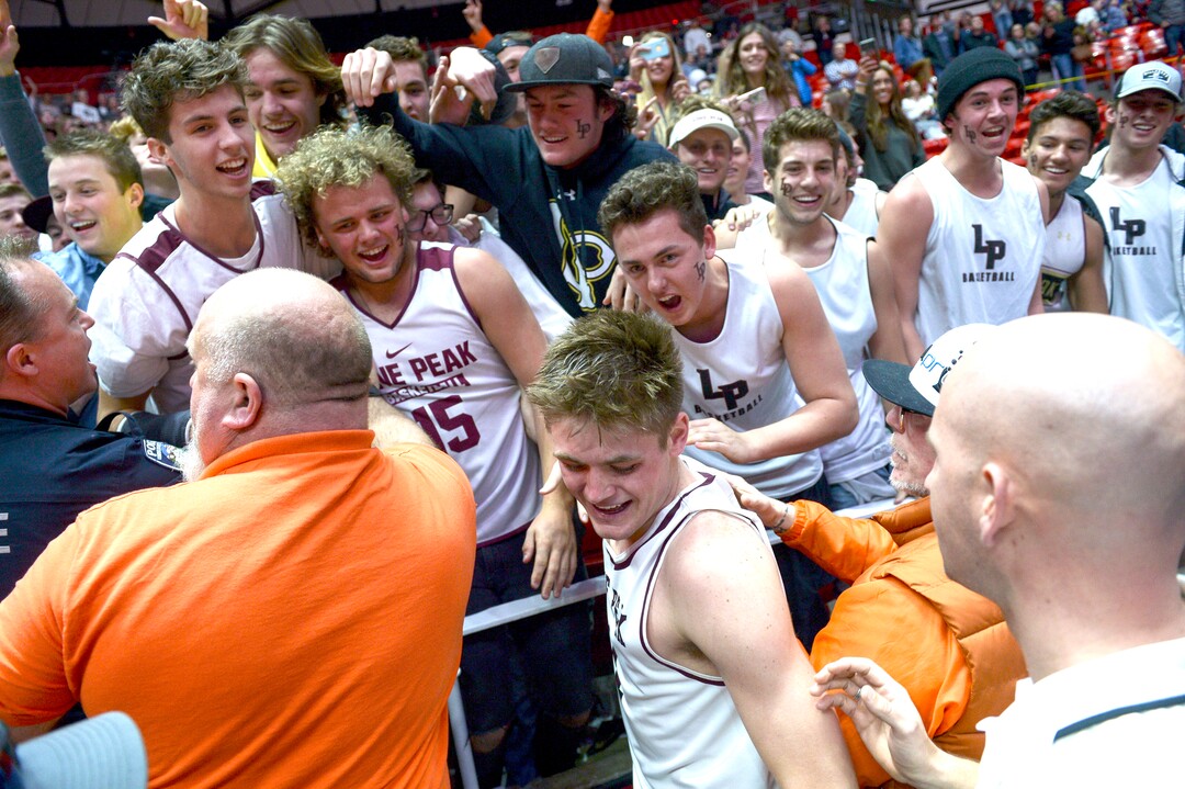 (Leah Hogsten  |  The Salt Lake Tribune) Lone Peak fans celebrate the win with Lone Peak's Max Brenchley (01). . Lone Peak defeated Pleasant Grove 61-44 to win the 6A High School BoysÕ Basketball Tournament Championship at the Jon M. Huntsman Center in Salt Lake City, Saturday, March 3, 2018. 