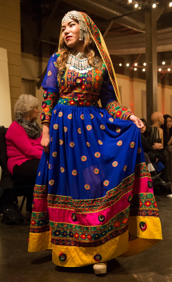 (Rick Egan  |  The Salt Lake Tribune)   Golshan from Afghanistan walks the runway during the 8th Annual Women of the World Fashion Show. The fashion show fund is raiser for the non-profit that seeks to help refugees settle in a new culture. Wednesday, March 7, 2018.