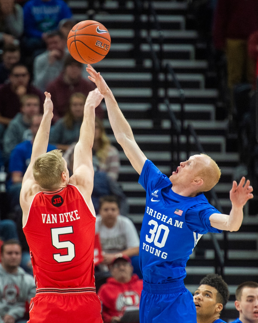 (Rick Egan  |  The Salt Lake Tribune)   Brigham Young Cougar Cougar guard, TJ Haws (30) blocks a shot by Utah Utes guard Parker Van Dyke (5), in basketball action in the Beehive Classic, between against the Brigham Young Cougars and Utah Utes, at the Vivint Smart Home Arena, Saturday December 8, 2018.