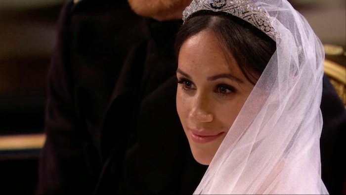 In this frame from video, Meghan Markle listens during her wedding ceremony with Britain's Prince Harry at St. George's Chapel in Windsor Castle in Windsor, near London, England, Saturday, May 19, 2018.  (UK Pool/Sky News via AP)