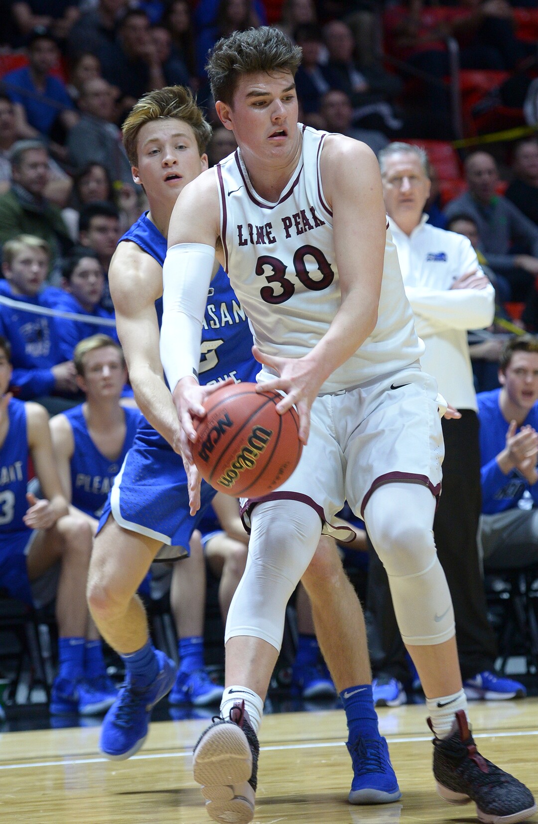 (Leah Hogsten  |  The Salt Lake Tribune) Pleasant Grove's Casey Brown (03) tries to steal from Lone Peak's Jackson Brinkerhoff (30). Pleasant Grove plays Lone Peak to win the 6A High School Boys’ Basketball Tournament Championship at the Jon M. Huntsman Center in Salt Lake City, Saturday, March 3, 2018. 