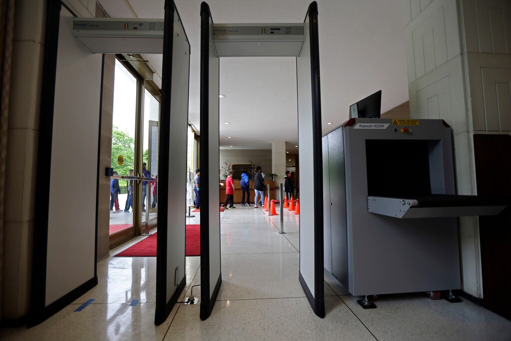 (AP Photo/Gerry Broome) In this Monday, April 23, 2018 photo, a group of school kids make their way past soon-to-be utilized security equipment into the Legislative Building in Raleigh, N.C.