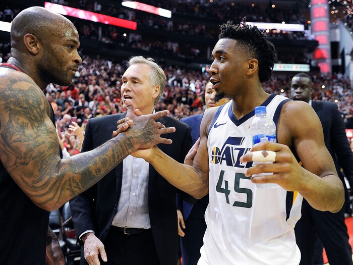 Utah Jazz' Donovan Mitchell, right, shakes hands with Houston Rockets' PJ Tucker after the team's loss in Game 5 of an NBA basketball second-round playoff series, Tuesday, May 8, 2018, in Houston. (AP Photo/Eric Christian Smith)