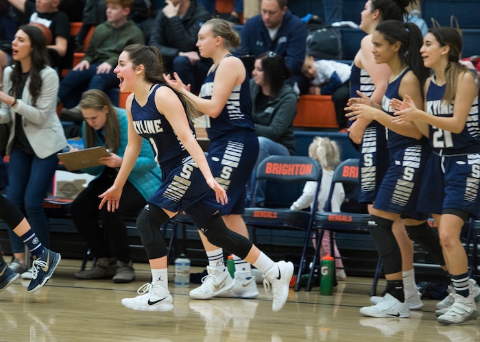 (Scott Sommerdorf   |  The Salt Lake Tribune)   Amit Lustgarten, left, and the rest of the starters rush the court after back ups finished off their rout of Brighton. Skyline defeated Brighton 66-33, Friday, January 5, 2018.