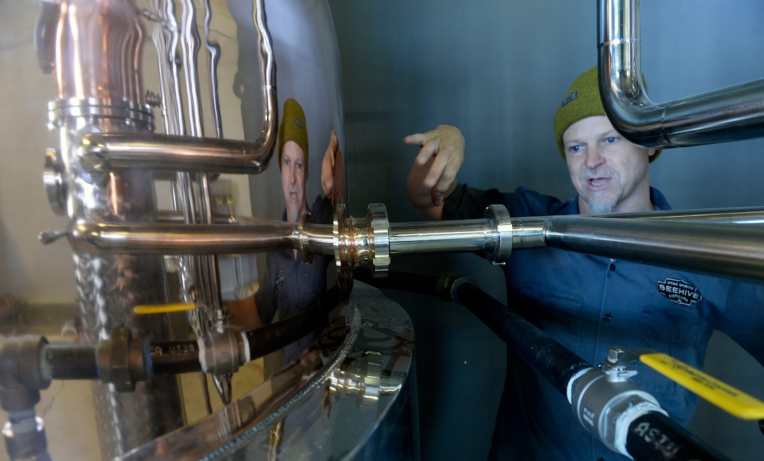 (Al Hartmann  |  The Salt Lake Tribune) 	Chris Barlow, head distiller, and co-owner of Beehive Distilling is getting the new beautifull copper distiller up and running at their new location at 2245 S. West Temple.  The small craft distillery that opened in 2013 producing Jack Rabbit Gin has grown since then, and recently moved to a new, 6,000-square-foot space that will allow it to increase production from the 80-gallons to more than 530 gallons.