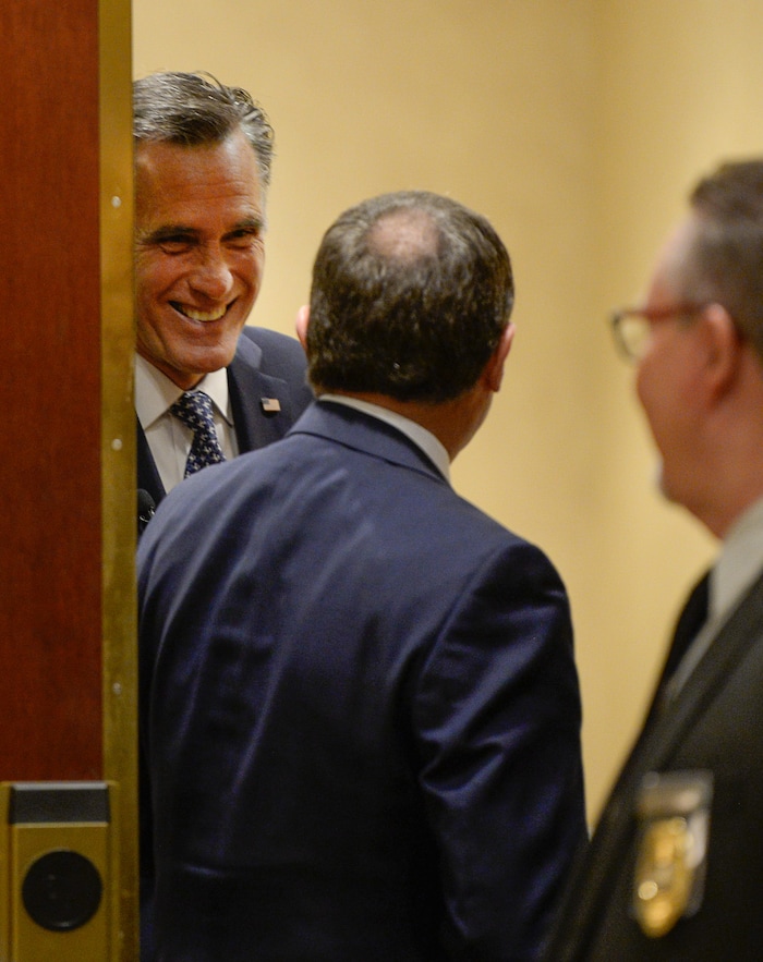 (Francisco Kjolseth  |  The Salt Lake Tribune)  Utah Gov. Gary Herbert, center, speaks with Mitt Romney prior to his speaking engagement at the Utah Economic Outlook & Policy Summit 2018, hosted by the Salt Lake Chamber at the Salt Lake City Marriott Downtown at City Creek on Tuesday, Jan. 16, 2018. 