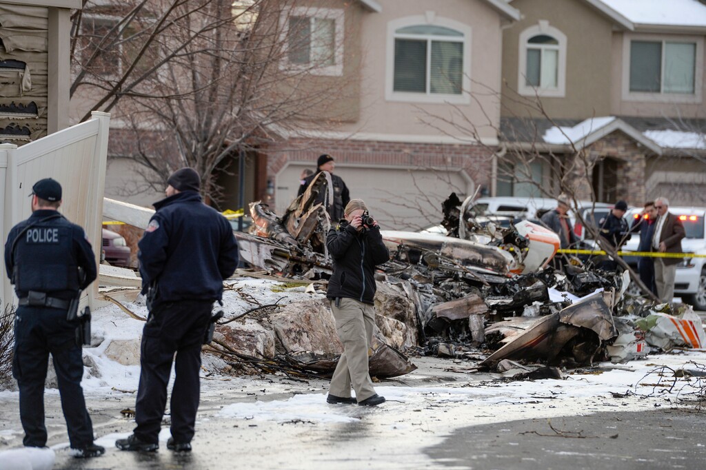 (Leah Hogsten  |  The Salt Lake Tribune) Weber County emergency personnel and firefighters work the scene of a small, private plane that crashed in a residential neighborhood in Roy, Jan 15, 2020.  A 64-year-old pilot was killed. 
