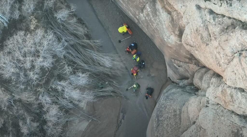 (Grand County Search and Rescue) A screenshot of drone footage showing Grand County Search and Rescue crews reaching hiker Austin Dirks after he became trapped in quicksand in Courthouse Wash on Dec. 7.