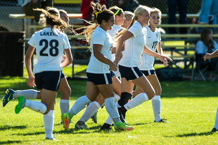 (Chris Detrick  |  The Salt Lake Tribune)  Bonneville's Hailey Price (3) celebrates with her teammates after scoring a goal during the game at Bonneville High School Wednesday, September 27, 2017.