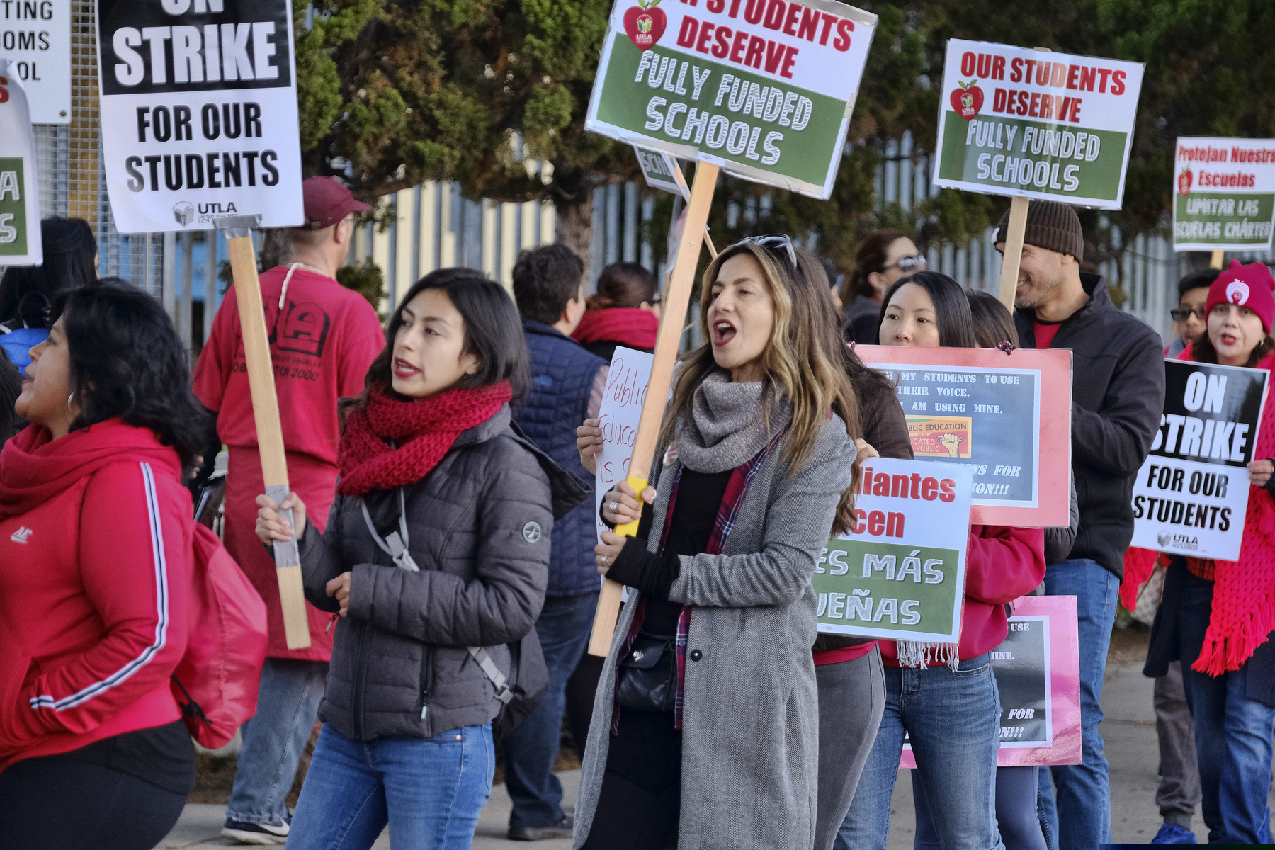 Striking Los Angeles Unified District teachers are joined by parents and students in front of Evelyn Thurman Gratts Elementary School in Los Angeles on Tuesday, Jan. 22, 2019. A tentative deal was reached Tuesday between Los Angeles school officials and the teachers union that will allow educators to return to classrooms after a six-day strike against the nation's second-largest district, officials said. (AP Photo/Richard Vogel)