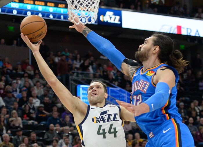 (Francisco Kjolseth  |  The Salt Lake Tribune)  Utah Jazz forward Bojan Bogdanovic (44) battles Oklahoma City Thunder center Steven Adams (12) as the Utah Jazz host the Oklahoma City Thunder in their NBA basketball game at Vivint Smart Home Arena in Salt Lake City on Mon. Dec. 9, 2019.